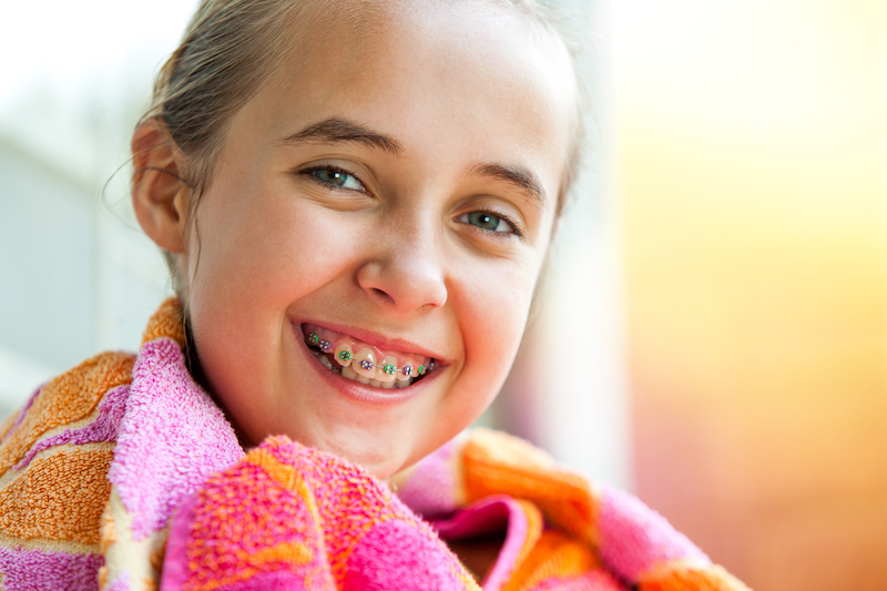 Cute girl with dental braces.